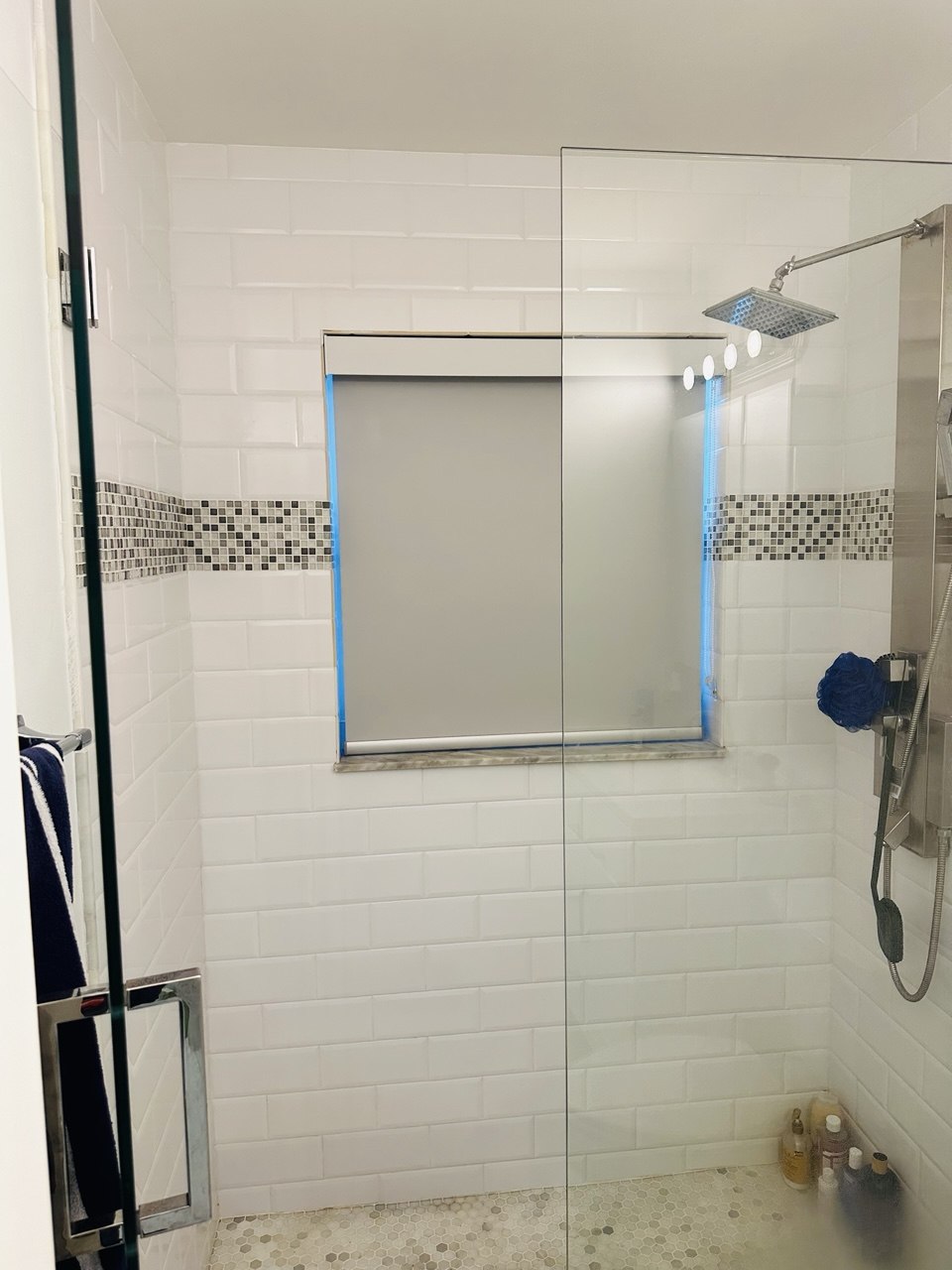 Custom roller shade fitted inside a Fort Lauderdale shower window