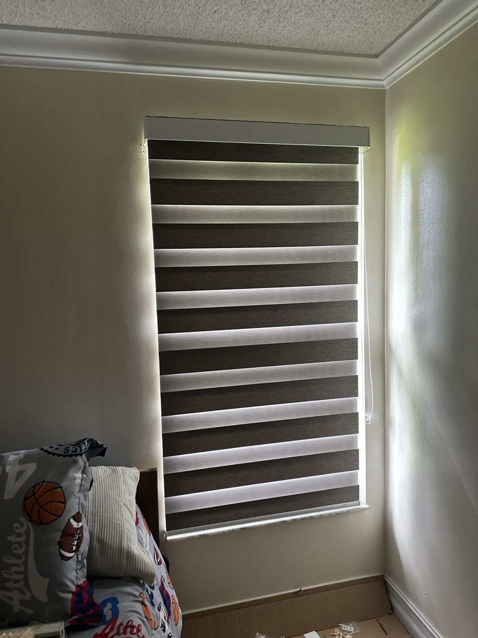 Manual zebra shade closed for privacy on a bedroom window in Royal Palm Beach