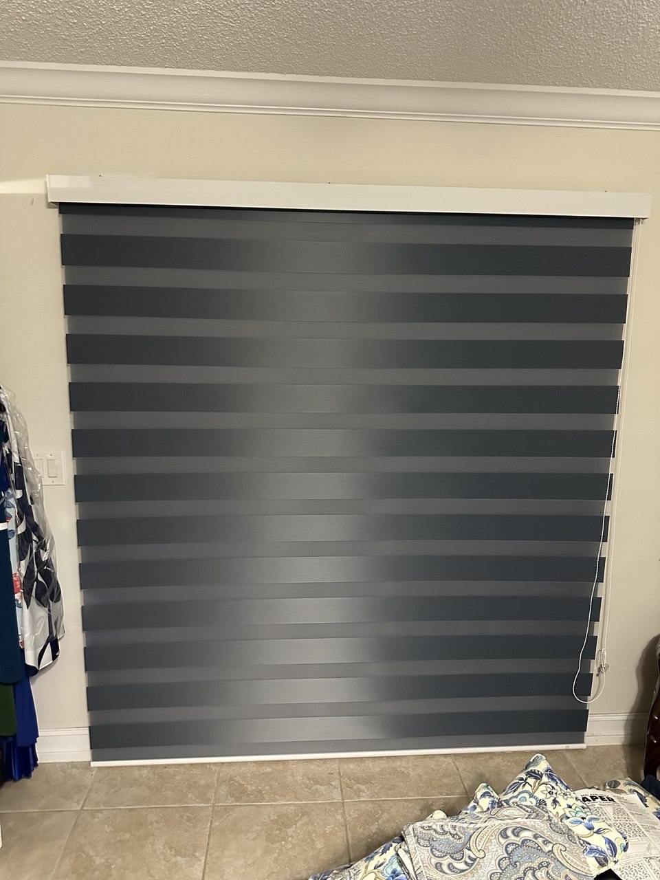 Manual zebra shade closed for increased privacy in a Miami home
