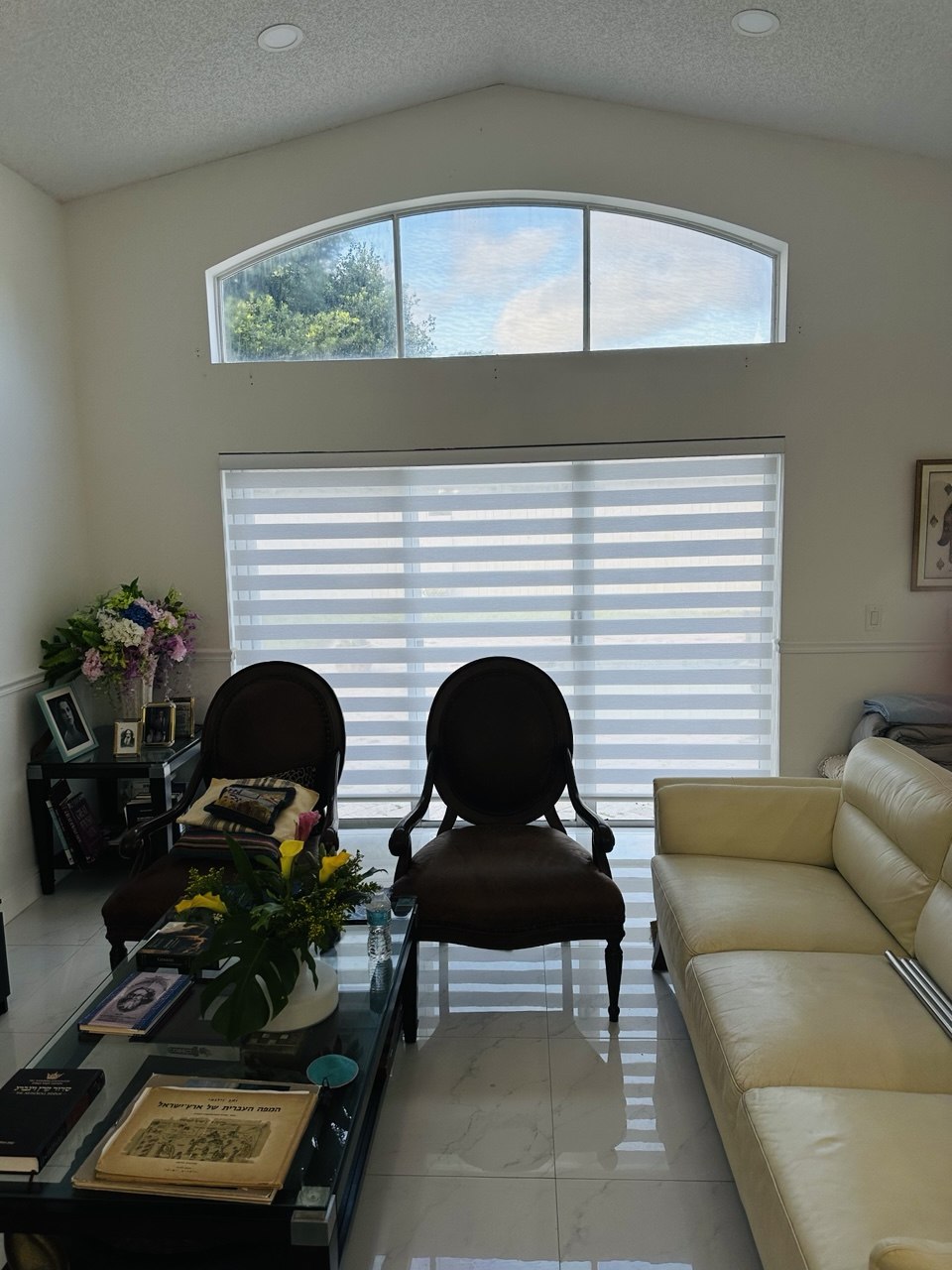 Fort Lauderdale living room with a custom zebra shade below the arched window