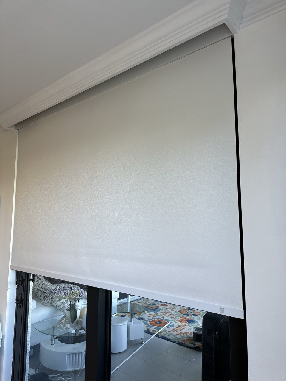 White motorized roller shade covering a bedroom slider in a Boca Raton condo