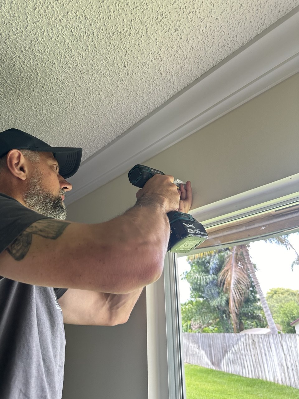 Miami Smart Blinds installer mounting a zebra shade headrail in Royal Palm Beach