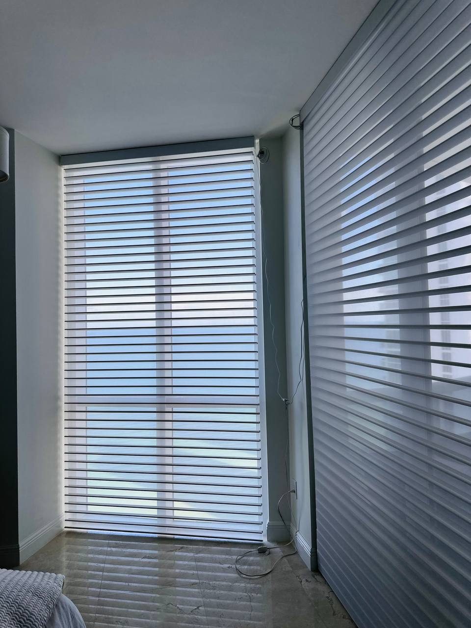 Shangri-La shades in an open light-filtering position on Miami apartment windows