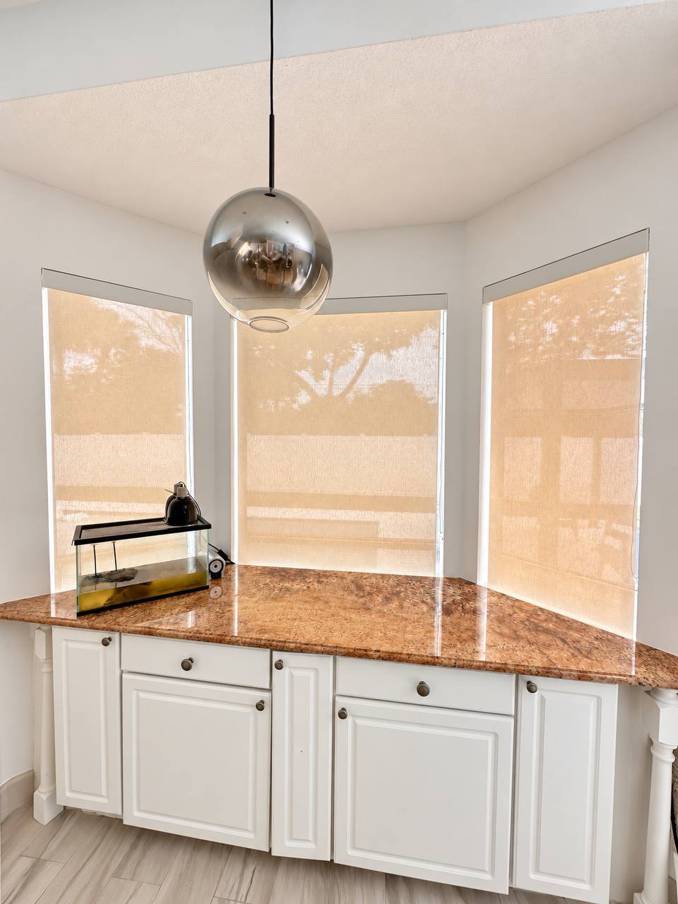 Sunscreen shades filtering afternoon light in a Keystone Lake kitchen, Hollywood