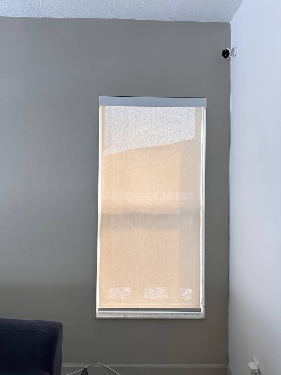 Custom sunscreen blinds on a tall window, angled view, Keystone Lake home