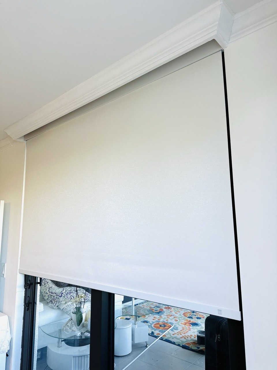 Motorized roller shade on a Boca Raton bedroom slider — completed installation