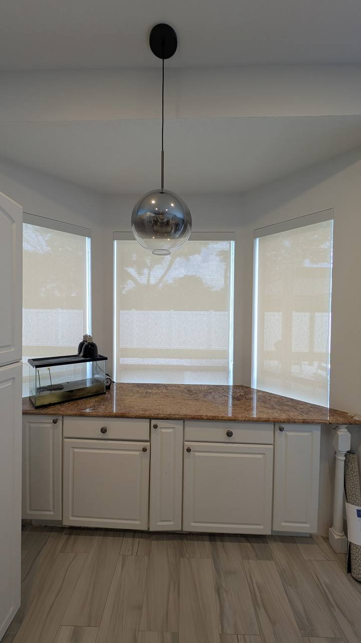Wide view of custom window shades over a kitchen counter bay in Hollywood FL