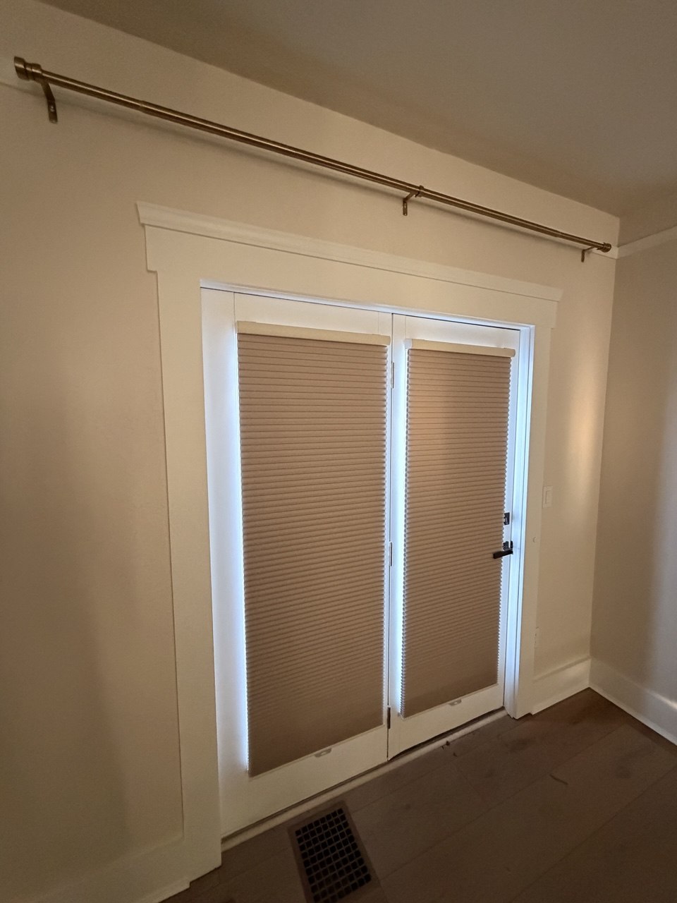 Cellular honeycomb shades installed on glass double doors in a Miami home