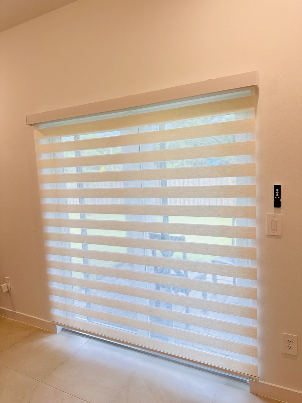 Custom motorized zebra shade on large window in Pompano Beach