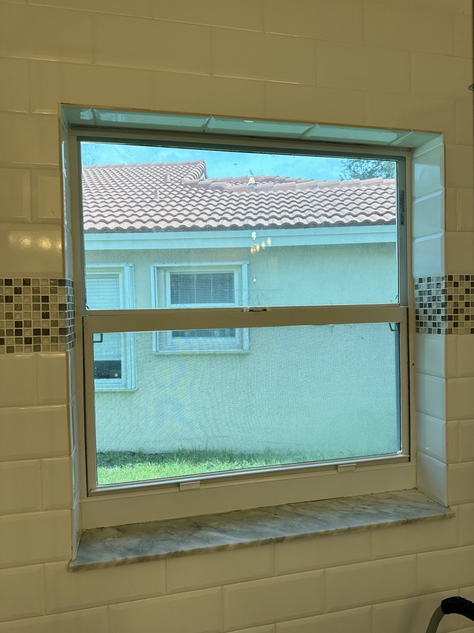 Bathroom window before roller shade installation Fort Lauderdale