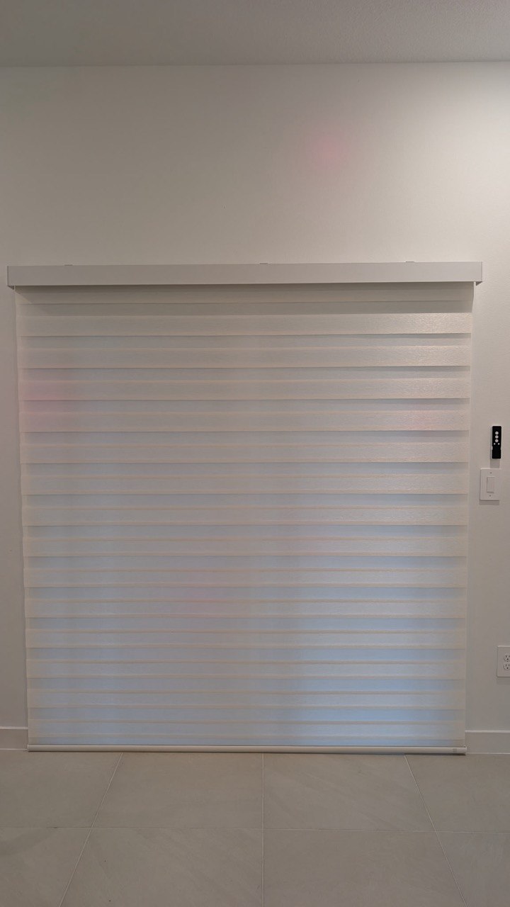 Motorized zebra blinds with wall control in Pompano Beach home