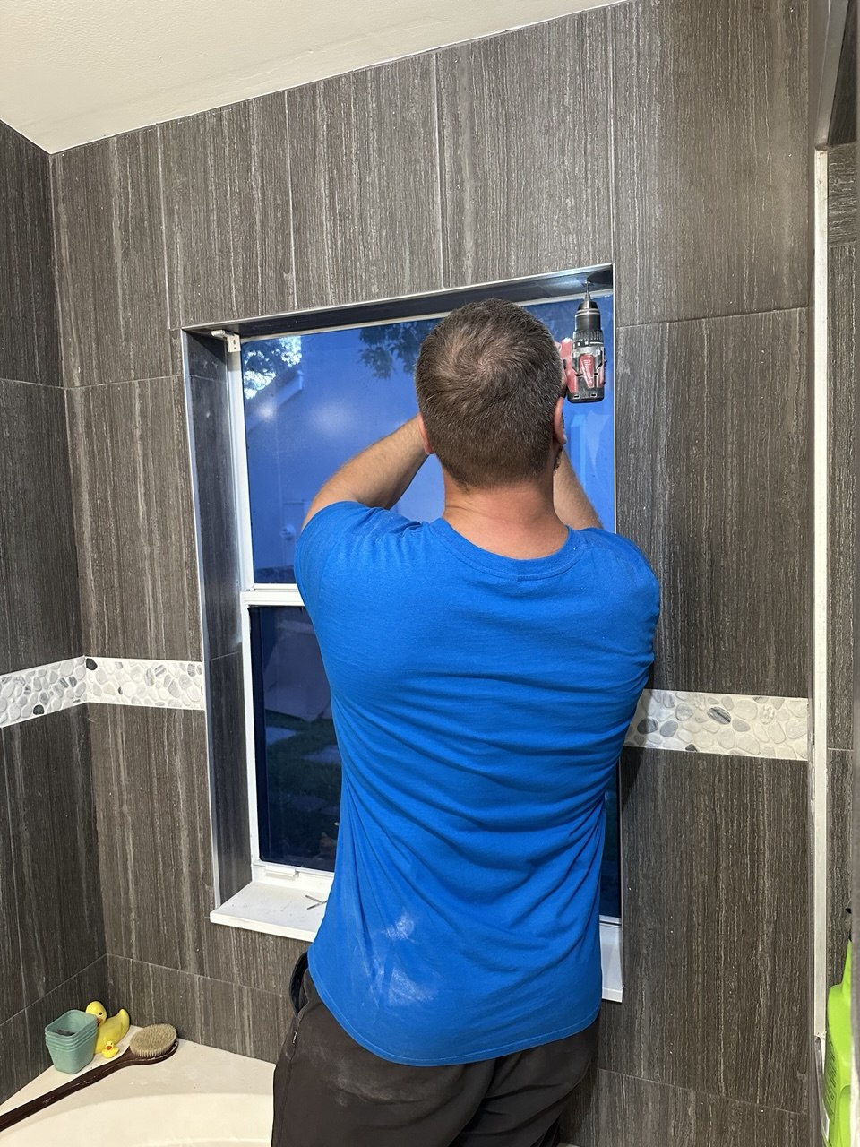 Roller shade installation process in a Fort Lauderdale bathroom