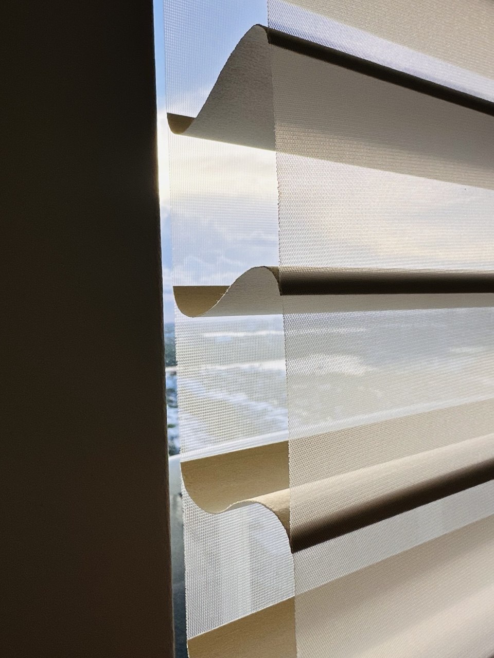 Close-up of Shangri-La sheer shades with adjustable fabric vanes