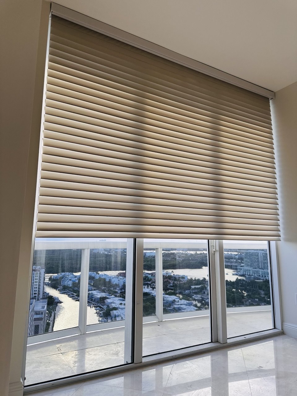 Motorized Shangri-La shades on a large window in the Miami area
